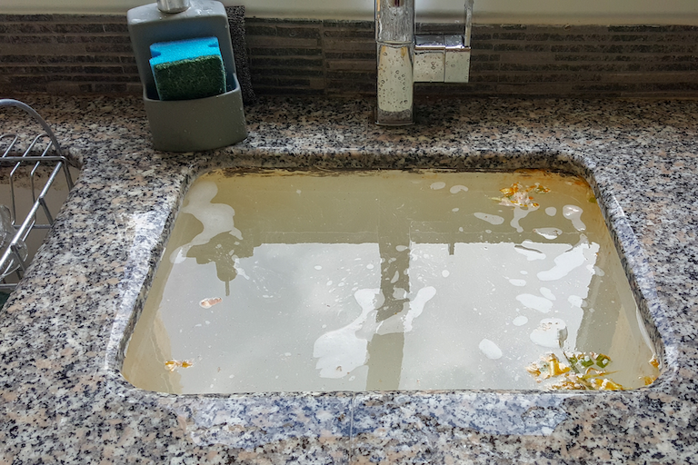 Clogged garbage disposal that leads to a clogged sink