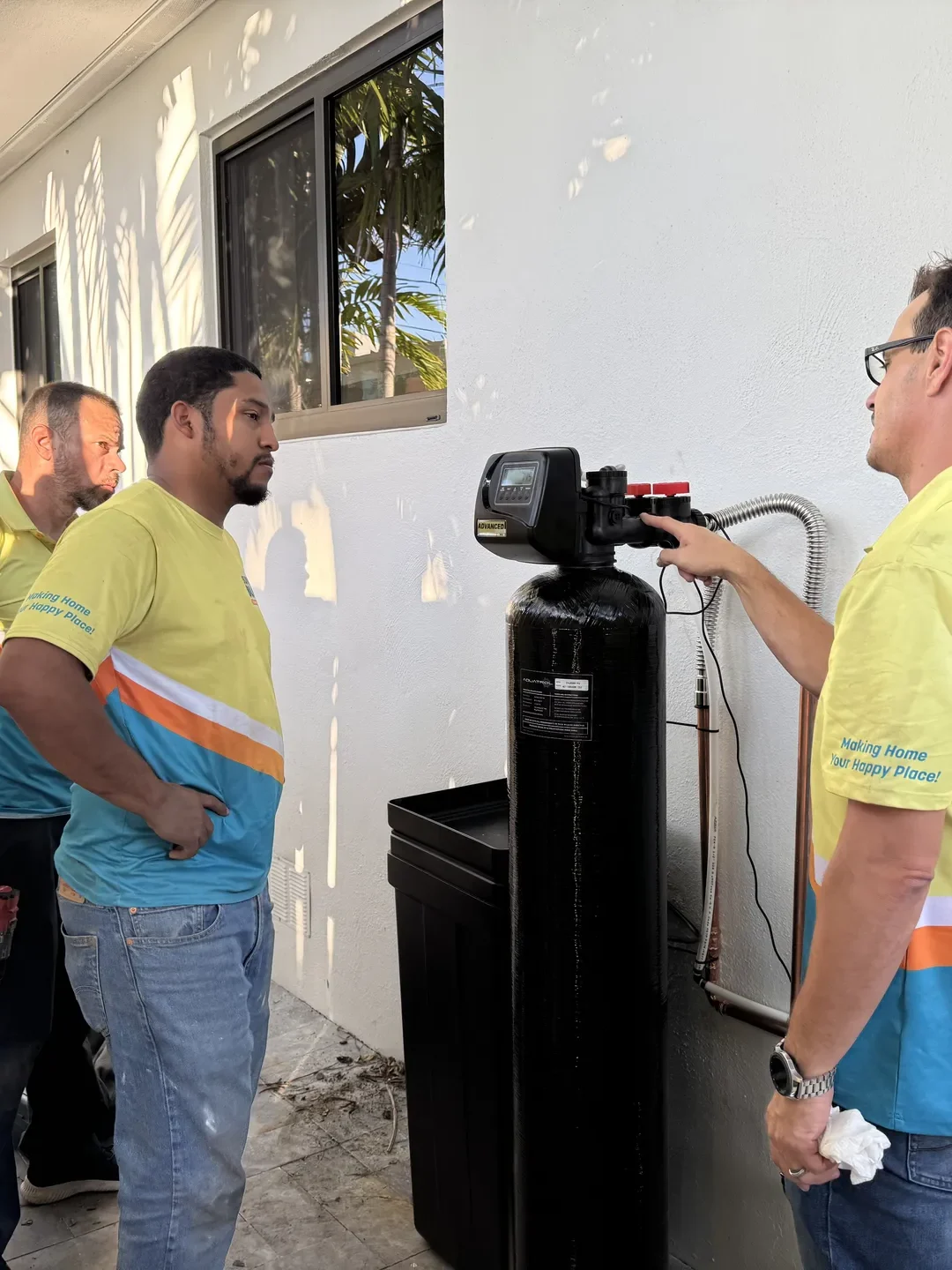 Plumber setting up whole home water filtration system