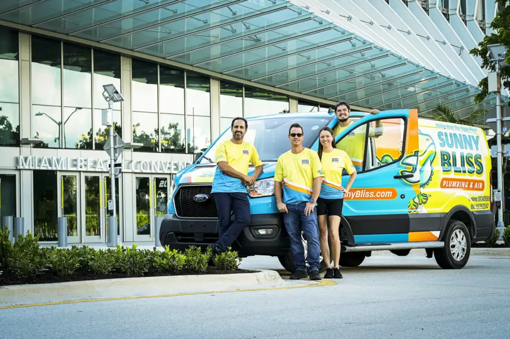Sunny Bliss Team in front of van and Miami Beach convention center